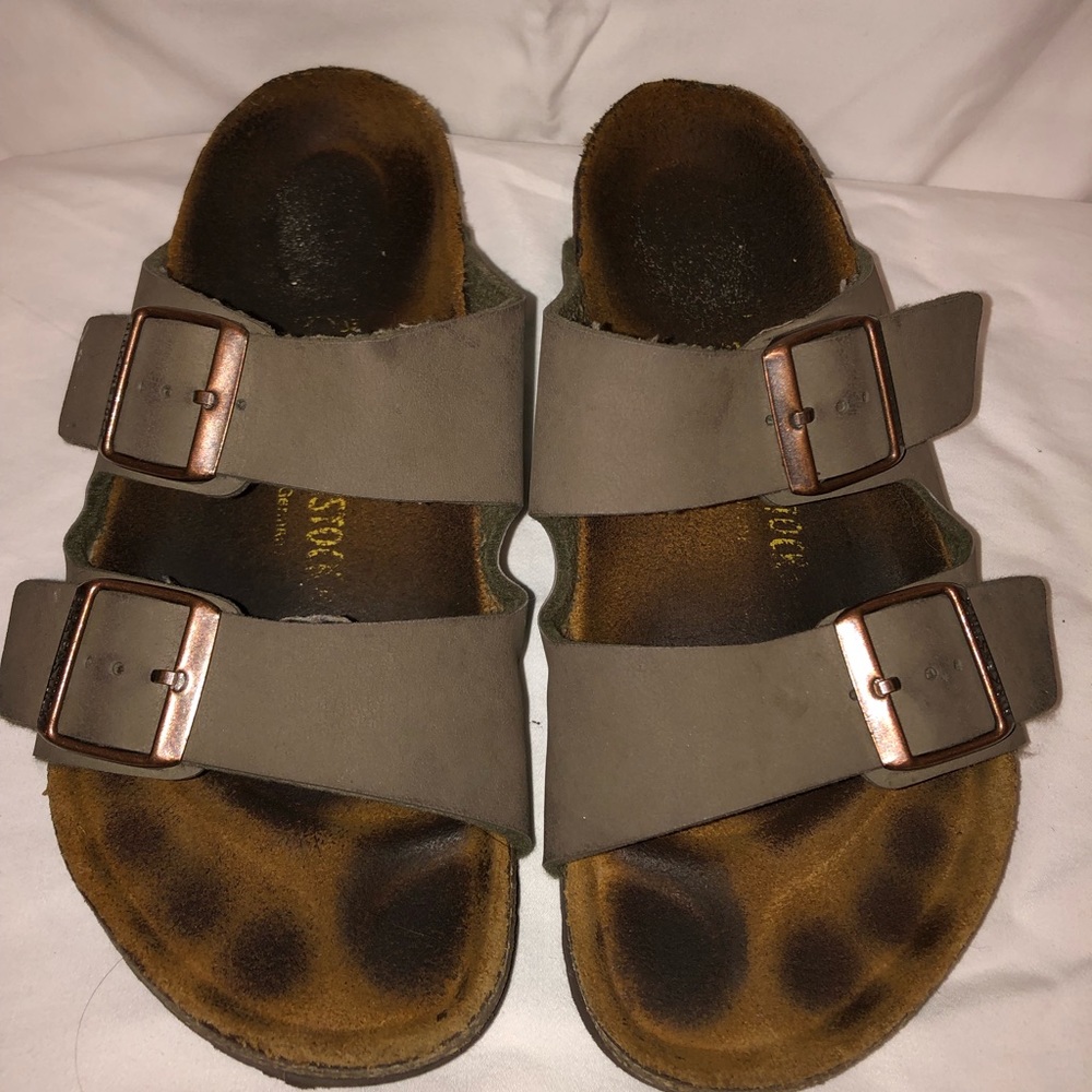 BIRKENSTOCK. lightly worn. tan/green color.